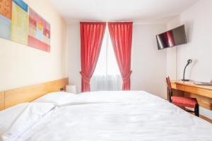 Voodi või voodid majutusasutuse Hotel Alpina toas