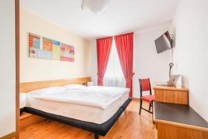 Voodi või voodid majutusasutuse Hotel Alpina toas
