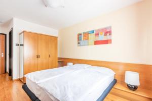 Voodi või voodid majutusasutuse Hotel Alpina toas