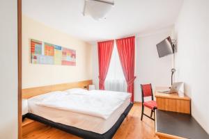 Voodi või voodid majutusasutuse Hotel Alpina toas
