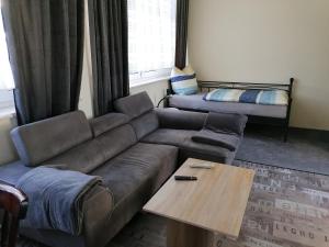 a living room with a couch and a table at Ferienwohnung Civrilli 3 in Dippelsdorf