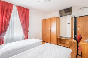 Voodi või voodid majutusasutuse Hotel Alpina toas