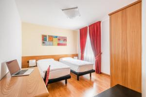 Voodi või voodid majutusasutuse Hotel Alpina toas