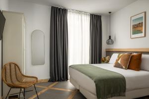A bed or beds in a room at La Sal by Pillow