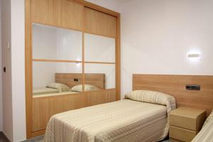 A bed or beds in a room at Hotel Albanta
