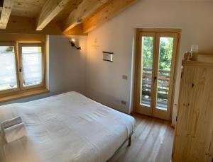 A bed or beds in a room at Chalet Baita delle Favole di RosaRita