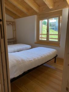 A bed or beds in a room at Chalet Baita delle Favole di RosaRita