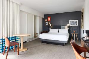 a hotel room with a bed and a table at Hotel Kabuki, part of JdV by Hyatt in San Francisco