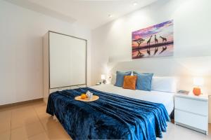 a bedroom with a large bed with a tray on it at Lodging Apartments Liceu G2 in Barcelona