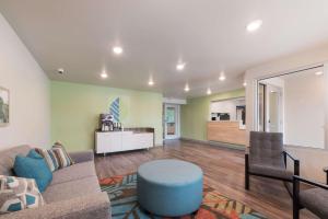 a living room with a couch and a table at WoodSpring Suites Philadelphia Northeast in Philadelphia