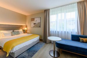 Postel nebo postele na pokoji v ubytování Hotel Europa