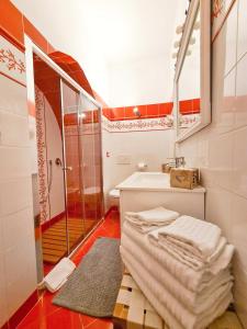 a bathroom with a sink and a toilet and a shower at Via Vittoria Quattro in Rome