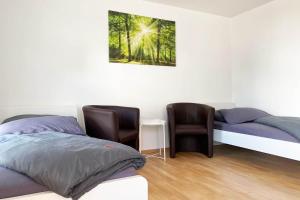 Postel nebo postele na pokoji v ubytování 1 Zimmer Apartment mit Balkon