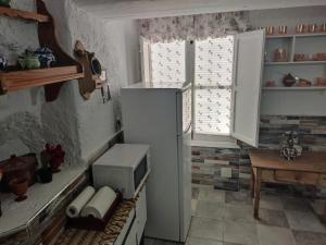 Kuchyň nebo kuchyňský kout v ubytování Cueva Navarro + 7 fotografií