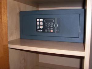 a microwave oven sitting on a shelf in a room at Hotel-Pension Flora in Saalbach Hinterglemm