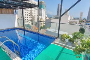 a swimming pool on the roof of a building at Two-Bedrooms - POOL SEA VIEW - 6A - BLUE SEA APARTMENT in Da Nang