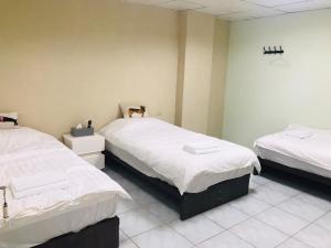 A bed or beds in a room at Together Stay