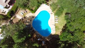 an overhead view of a large blue lake at Kampaoh Cazorla in El Valle