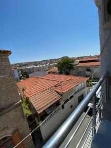 a view of a building with red tile roofs at Blue otel çeşme in Cesme