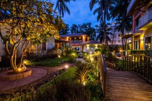 a pathway leading to a house with lights at Beach 7 mins walk Luxury villa Diva in Calangute