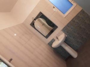 a bathroom with a sink and a mirror at House 28 in Orikum