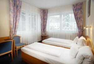 Postel nebo postele na pokoji v ubytování Pension Kern