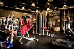 a man is in a gym lifting weights at Hotel Galion in Gdańsk