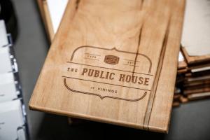 a wooden table with the public house logo on it at Hotel Indigo Atlanta Vinings, an IHG Hotel in Atlanta