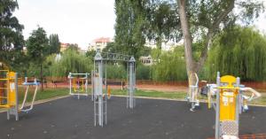 a playground in a park with a tree at Downtown Buda Homes Relax in Budapest