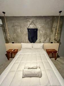 Voodi või voodid majutusasutuse Ariché Valladolid Hotel & Hostal toas