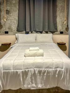 Voodi või voodid majutusasutuse Ariché Valladolid Hotel & Hostal toas