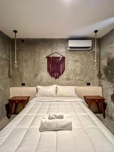 Voodi või voodid majutusasutuse Ariché Valladolid Hotel & Hostal toas