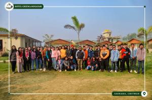 a large group of people posing for a picture at Hotel Greenland Safari in Sauraha