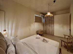 Un pat sau paturi într-o cameră la Solis Occasum