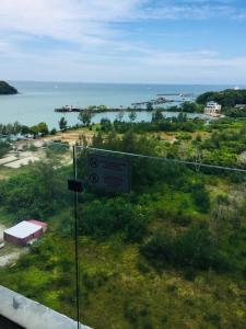 a sign on the side of a road near the ocean at Private Residence in Port Dickson +9 photos
