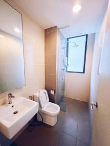 a bathroom with a sink and a toilet and a shower at Connected train 3 Bedrooms - ABOVE KLGATEWAY MALL 14 in Kuala Lumpur