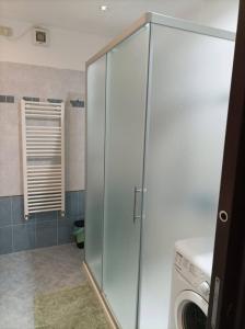 a washer and dryer in a bathroom with a washing machine at La porta del Sole in Seborga