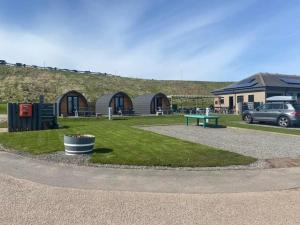 a park with a bench and a building at Marina Bay Pods in Aberdeen +8 photos