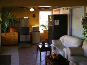 a living room with a couch and a table at FIRST WESTERN INN in Caseyville