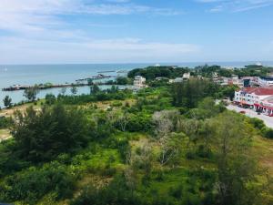 an aerial view of a city and the ocean at Private Residence in Port Dickson