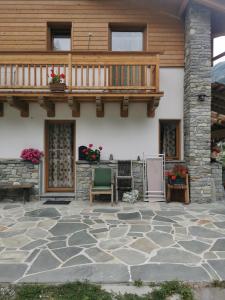 a patio with a deck on a house at Chalet Gaspard in Valtournenche