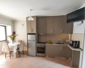 A kitchen or kitchenette at Vacations in Corfu-Antiperni by CorfuEscapes