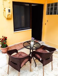 A seating area at Vacations in Corfu-Antiperni by CorfuEscapes