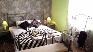 A bed or beds in a room at Carmen Seaview & Beach - Apartment