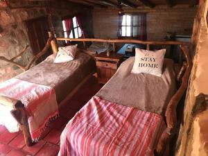 Postel nebo postele na pokoji v ubytování Pachamama cabañas en la montaña