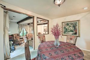 a dining room with a table with a vase on it at Family-Friendly Redmond Home with Spacious Deck in Redmond