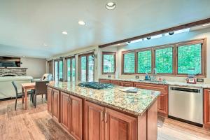 a kitchen with wooden cabinets and a large counter top at Family-Friendly Redmond Home with Spacious Deck in Redmond
