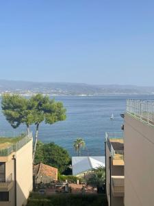 a view of the ocean from a building at Casa Cannoni - Delizioso Appartamento Fronte Mare vista Stretto di Messina in Messina