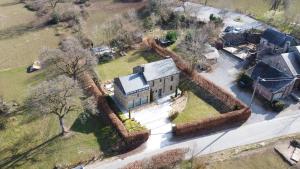 an aerial view of a large house with a yard at ARVAK HEYD (DURBUY) in Heyd