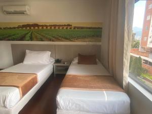 Hotel Portón Sabaneta客房内的一张或多张床位